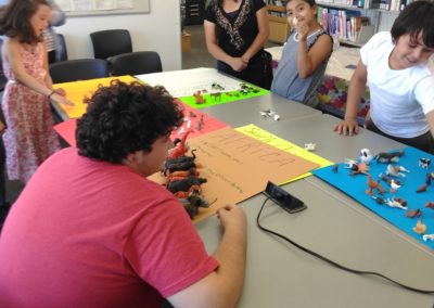 A group of people sitting around a table.